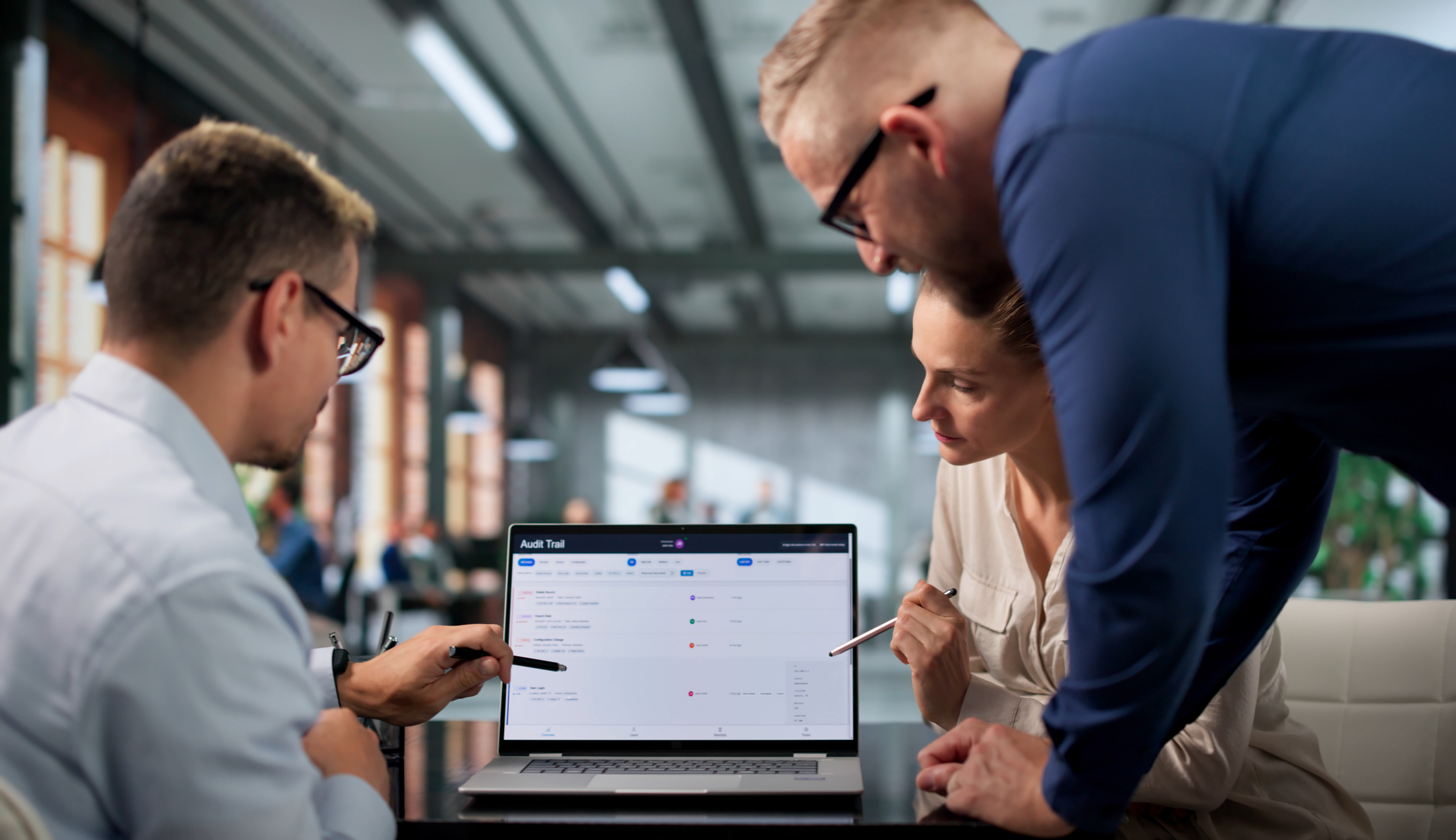 Diverse Team Of Auditors Uses Laptops